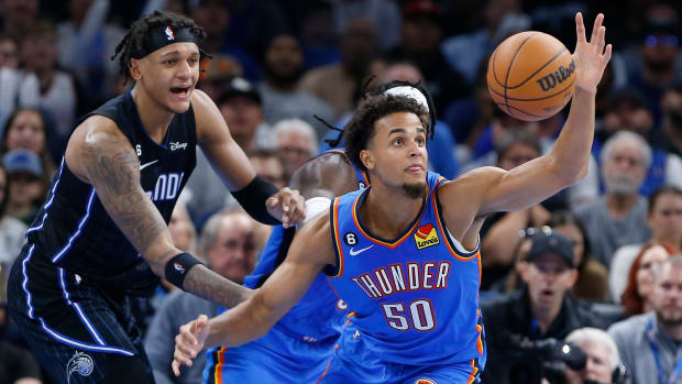 Nov 1, 2022; Oklahoma City, Oklahoma, USA; Oklahoma City Thunder forward Jeremiah Robinson-Earl (50) reaches for a loose ball against the Orlando Magic during the second half at Paycom Center. Oklahoma City won 116-108. Mandatory Credit: Alonzo Adams-USA TODAY Sports